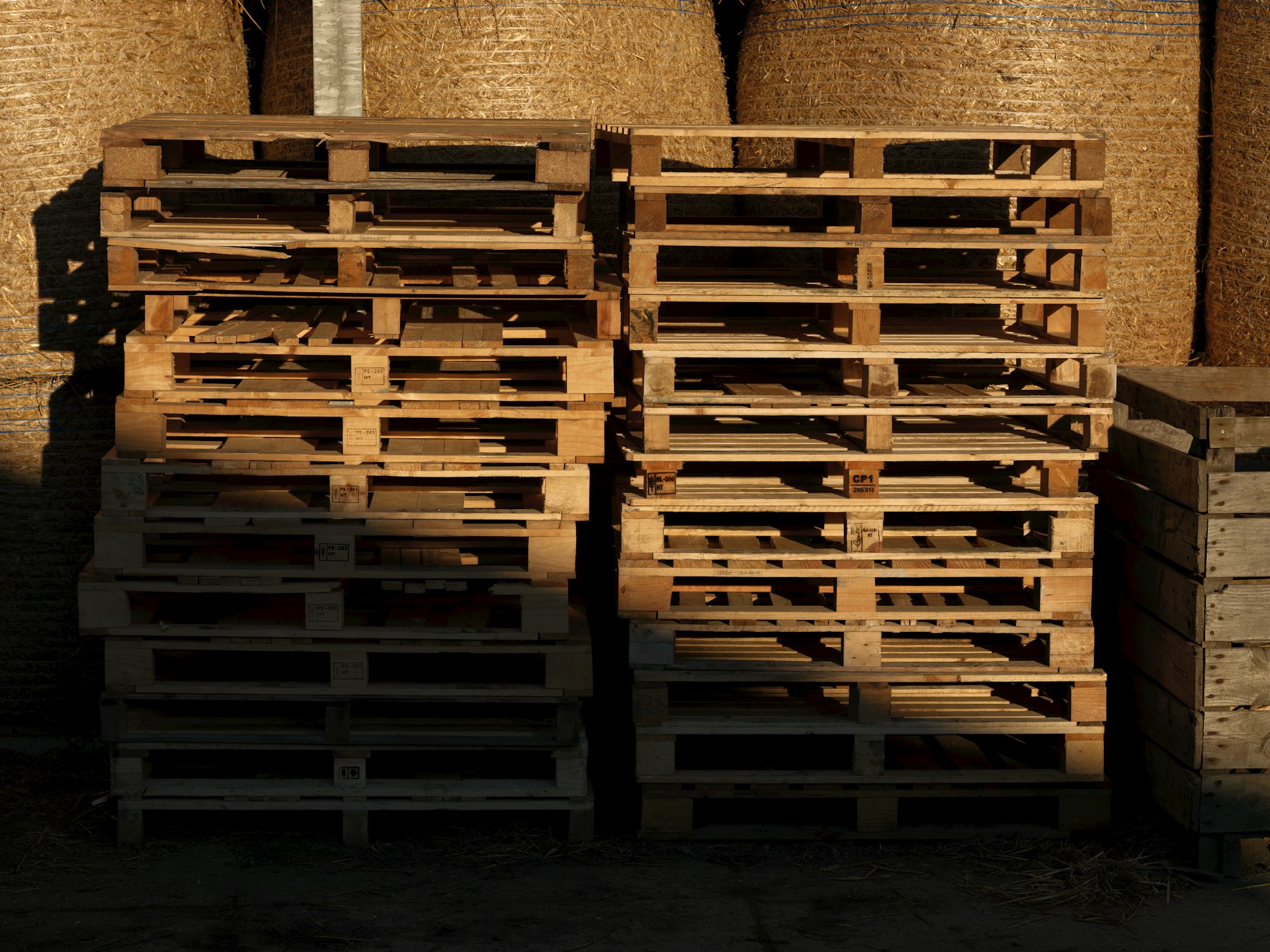 A pile of wooden crates sitting next to each other